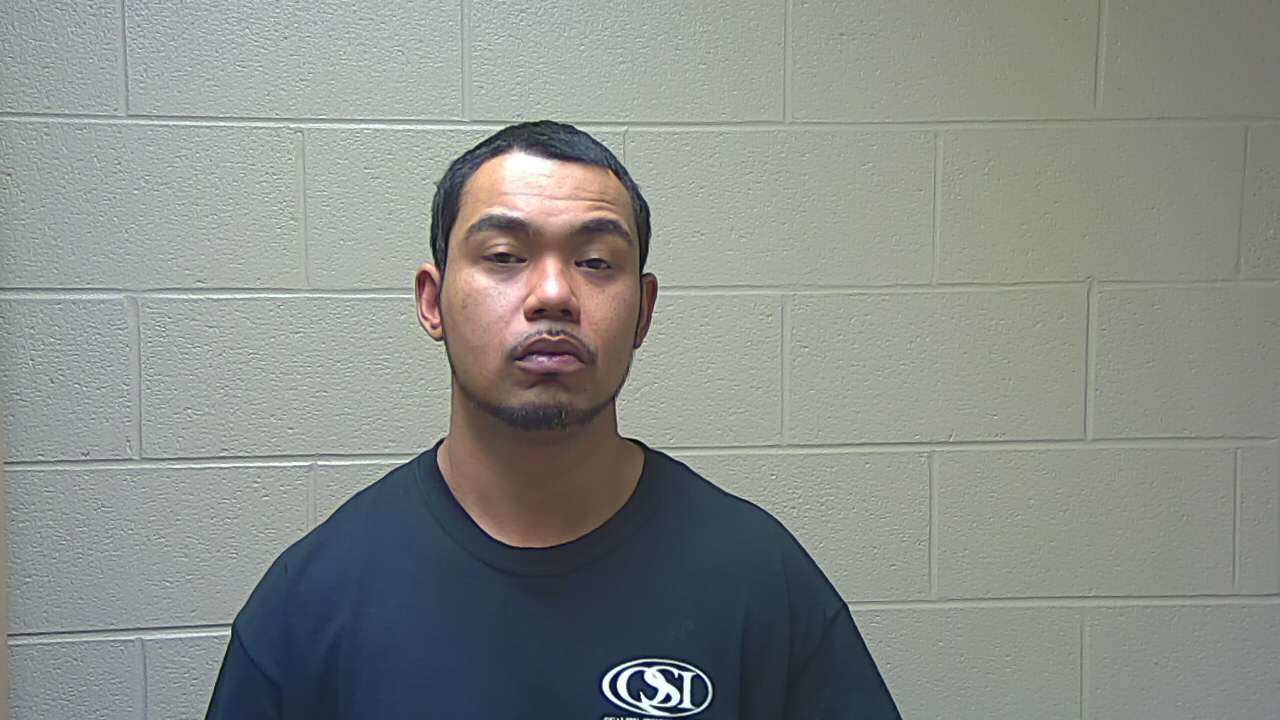 Man Smoking Pot Found with Stolen Gun