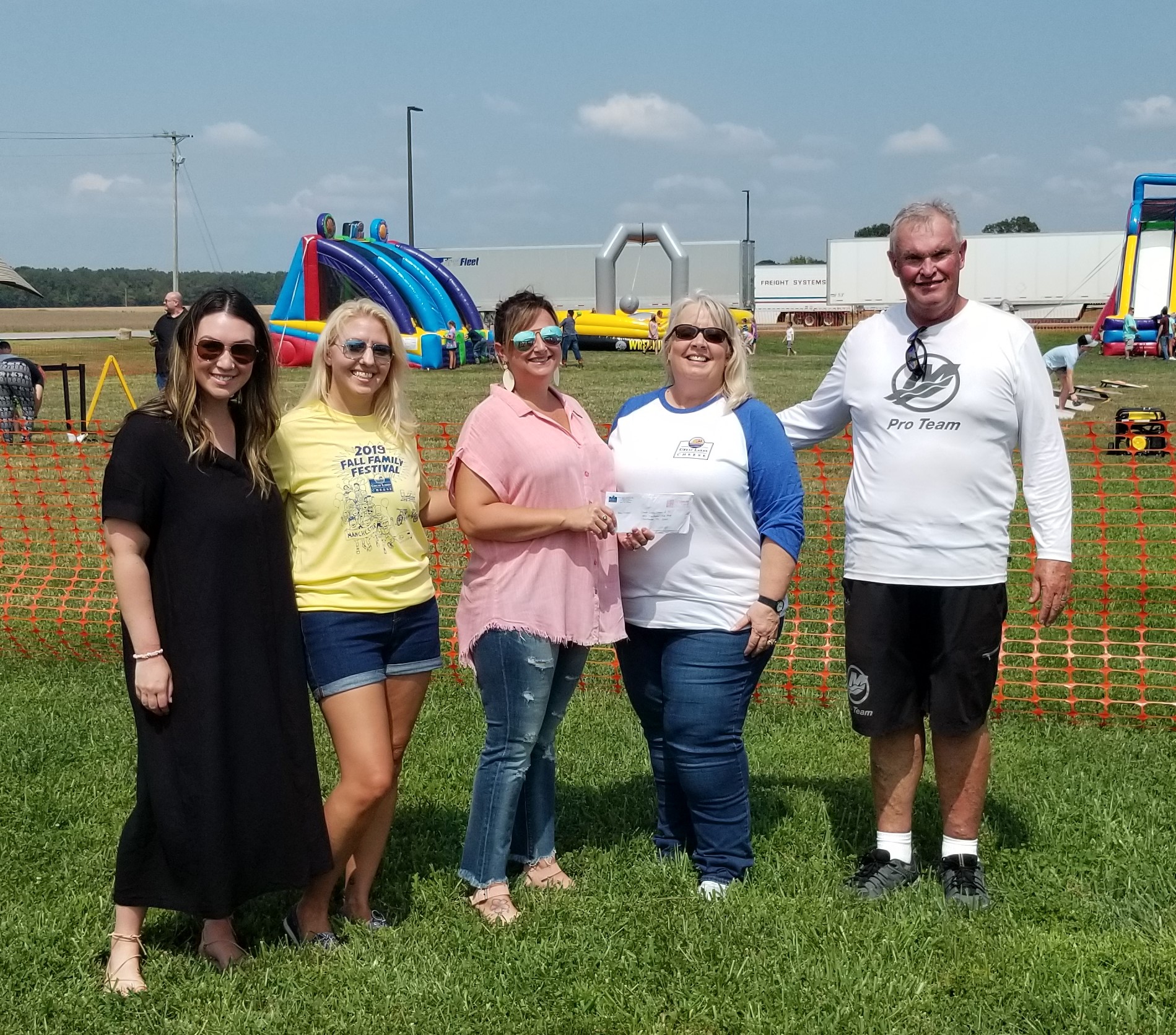 Great Lakes Cheese employees donate to school system