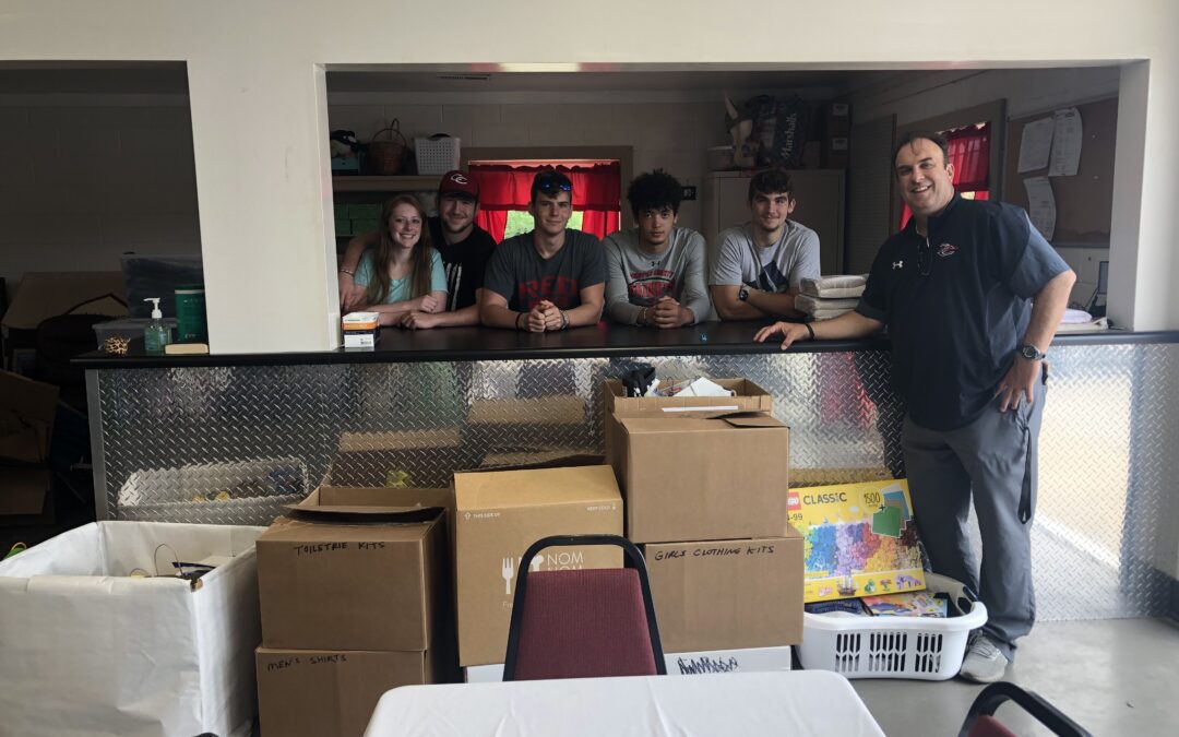 Raider football makes donation to Isaiah 117 house