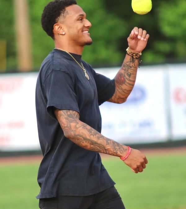 Alontae Taylor throws out first pitch of district softball touranment